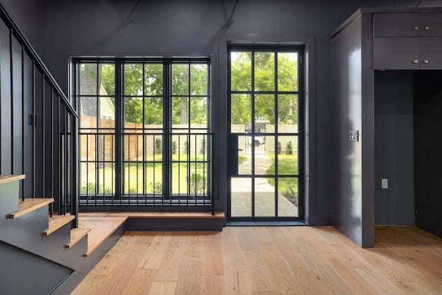 933 E 52nd St, Austin, TX 78751 - entryway with stairs and light wood-style floors