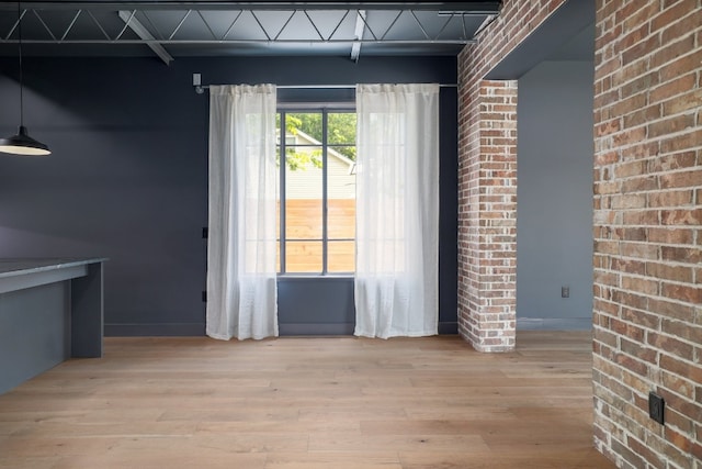 933 E 52nd St, Austin, TX 78751 - unfurnished dining area featuring wood finished floors