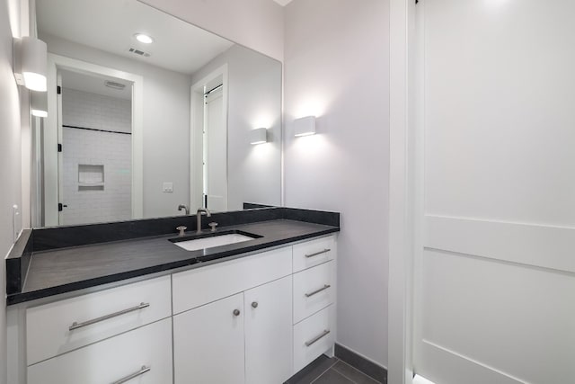 933 E 52nd St, Austin, TX 78751 - bathroom featuring vanity, tile patterned flooring, and recessed lighting