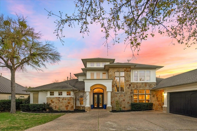 11801 Astoria Dr, Bee Cave, TX 78738 - view of front of home with french doors, stone siding, concrete driveway, and stucco siding