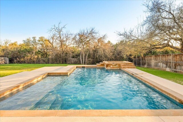 view of pool featuring a lawn, a fenced in pool, and a fenced backyard