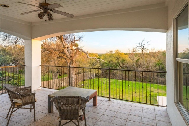 balcony featuring ceiling fan and a patio area