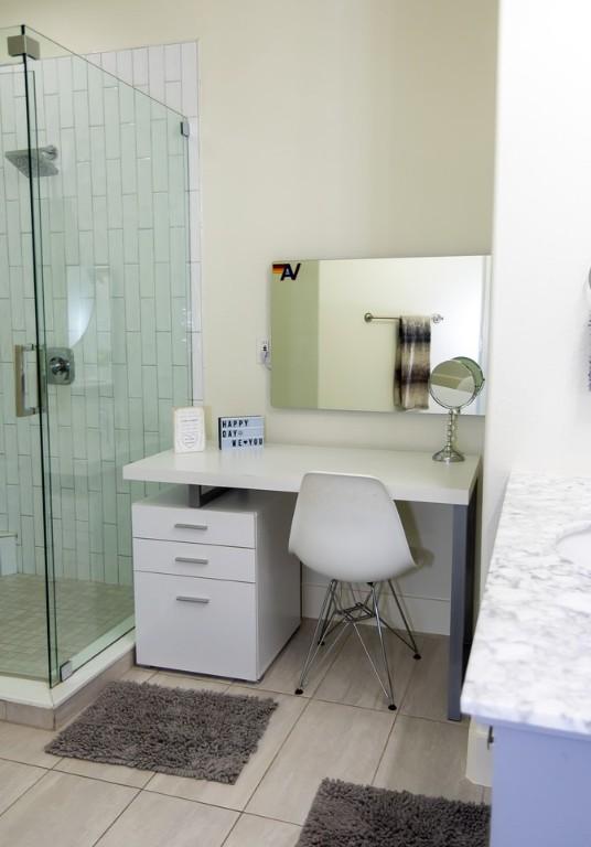 bathroom featuring a shower stall, tile patterned floors, and vanity