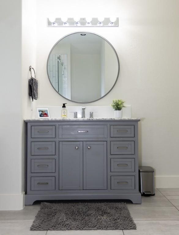 bathroom featuring baseboards and vanity