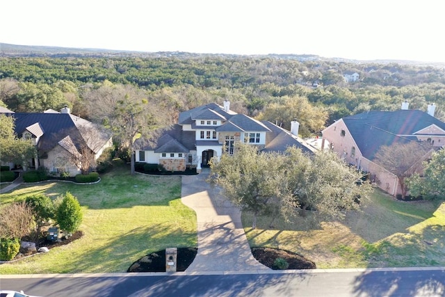 aerial view with a wooded view