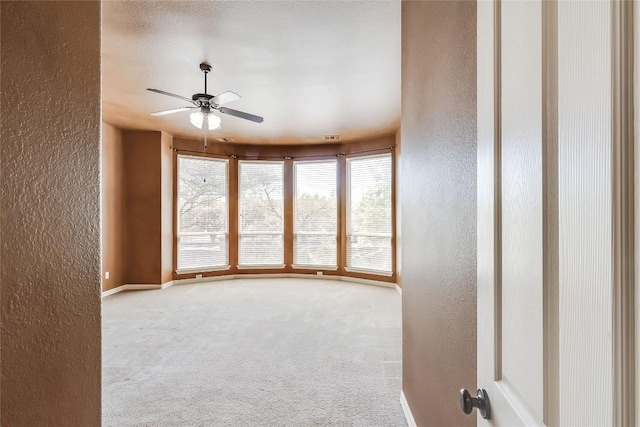 3519 Alexandrite Way, Round Rock, TX 78681 - carpeted spare room featuring a textured wall and ceiling fan