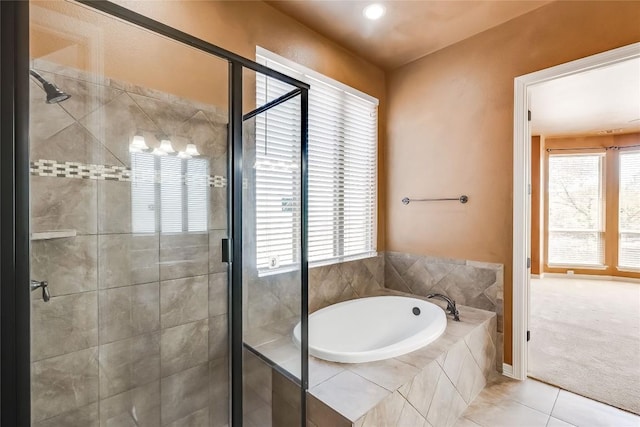 3519 Alexandrite Way, Round Rock, TX 78681 - full bathroom featuring a bath, a shower stall, healthy amount of natural light, and tile patterned flooring