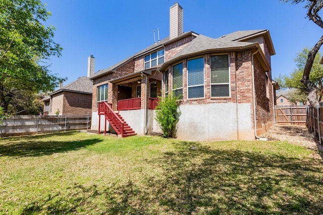 3519 Alexandrite Way, Round Rock, TX 78681 - back of house featuring brick siding, stairs, a chimney, and a fenced backyard
