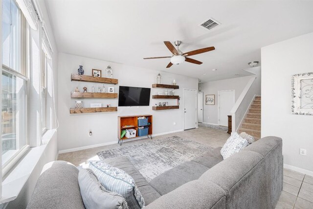 366 Eagle Brook Ln, Buda, TX 78610 - living room with ceiling fan, healthy amount of natural light, stairs, and baseboards