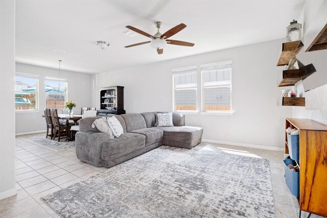 366 Eagle Brook Ln, Buda, TX 78610 - living room with a ceiling fan, baseboards, and light tile patterned floors