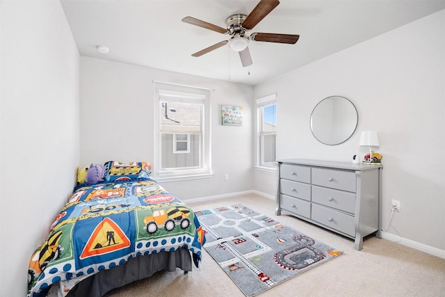366 Eagle Brook Ln, Buda, TX 78610 - bedroom featuring baseboards, light carpet, and a ceiling fan