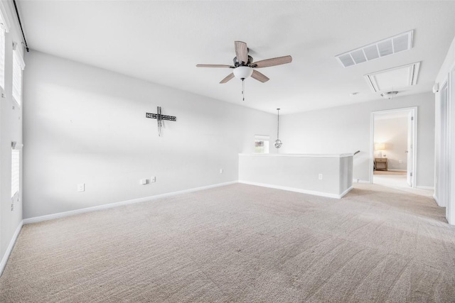 366 Eagle Brook Ln, Buda, TX 78610 - empty room with attic access, light colored carpet, a ceiling fan, and plenty of natural light