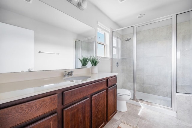 366 Eagle Brook Ln, Buda, TX 78610 - bathroom featuring vanity, tile patterned floors, and a stall shower