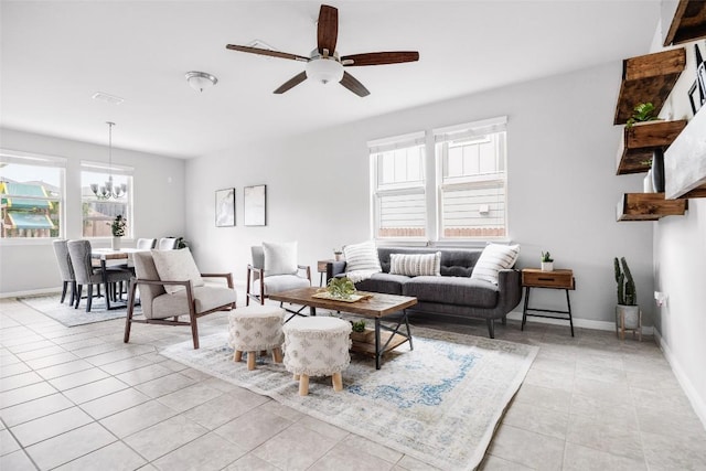 366 Eagle Brook Ln, Buda, TX 78610 - living area with a chandelier, light tile patterned flooring, and a ceiling fan