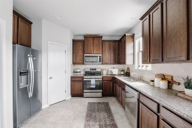 366 Eagle Brook Ln, Buda, TX 78610 - kitchen with appliances with stainless steel finishes and backsplash