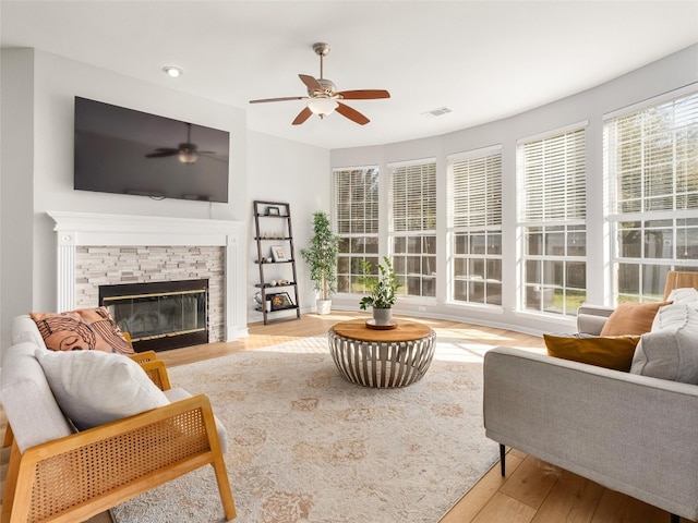 11009 Savannah Ct, Austin, TX 78739 - living area with a ceiling fan, wood finished floors, a fireplace, and recessed lighting