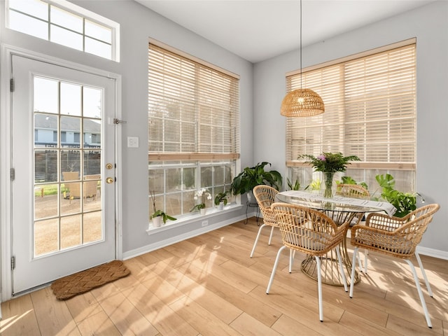 dining area featuring baseboards and wood finished floors