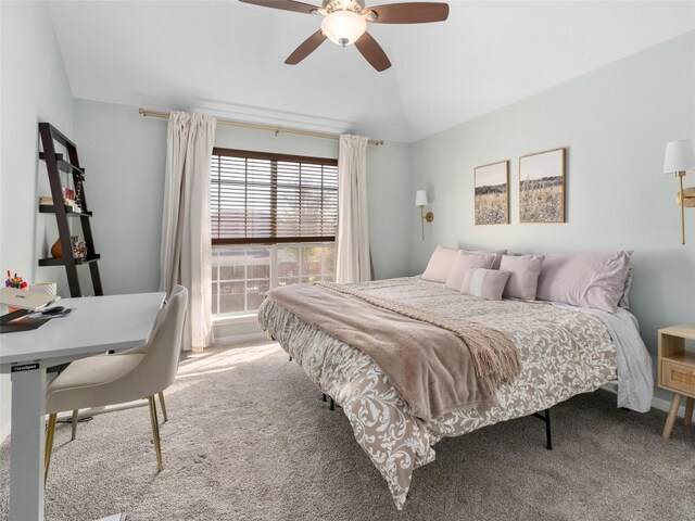 bedroom featuring carpet flooring, a ceiling fan, and lofted ceiling