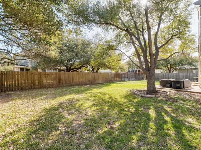 view of yard with a fenced backyard