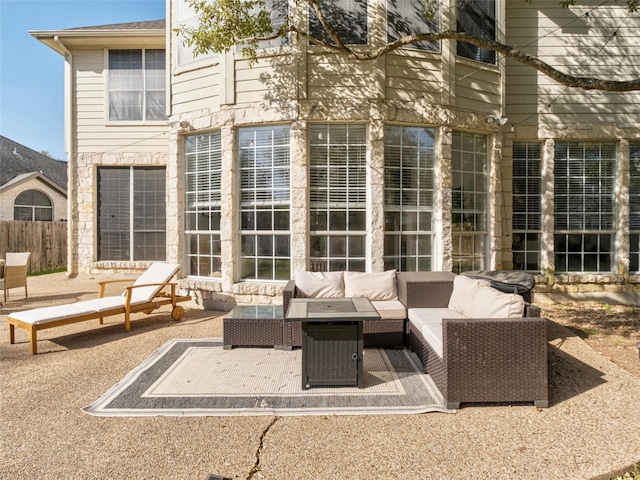 view of patio with fence and outdoor lounge area