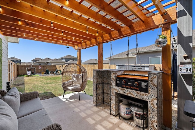 view of patio featuring a pergola and a fenced backyard