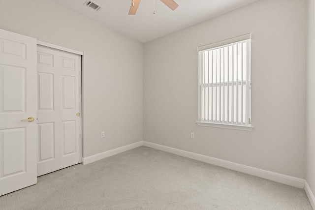 210 Crockett Loop, Georgetown, TX 78633 - spare room with light carpet, a ceiling fan, baseboards, and plenty of natural light