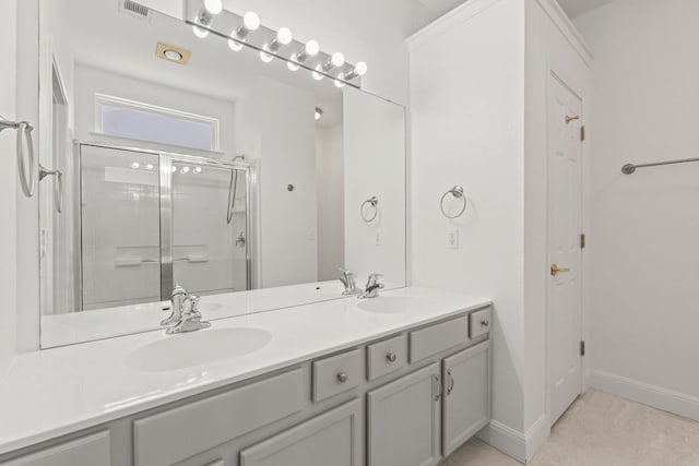 210 Crockett Loop, Georgetown, TX 78633 - full bathroom featuring a shower stall, double vanity, and baseboards