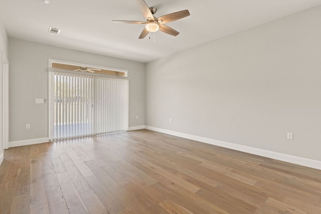 210 Crockett Loop, Georgetown, TX 78633 - spare room with a ceiling fan, wood finished floors, and baseboards