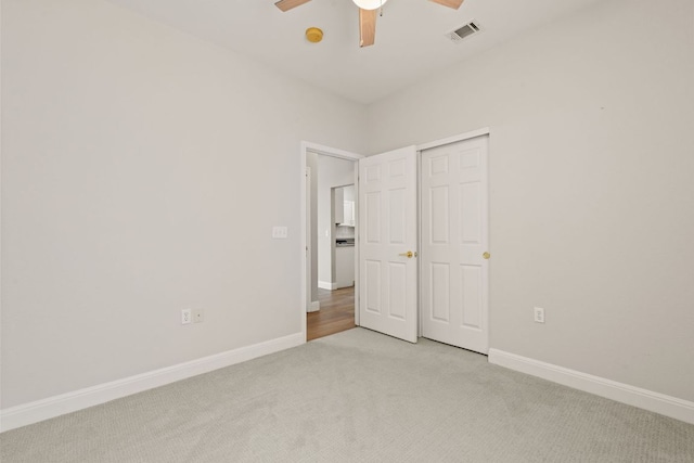 210 Crockett Loop, Georgetown, TX 78633 - unfurnished bedroom with light colored carpet, baseboards, and ceiling fan