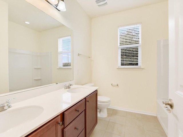 1501 Uhland Dr, Leander, TX 78641 - full bathroom with double vanity, washtub / shower combination, and tile patterned flooring