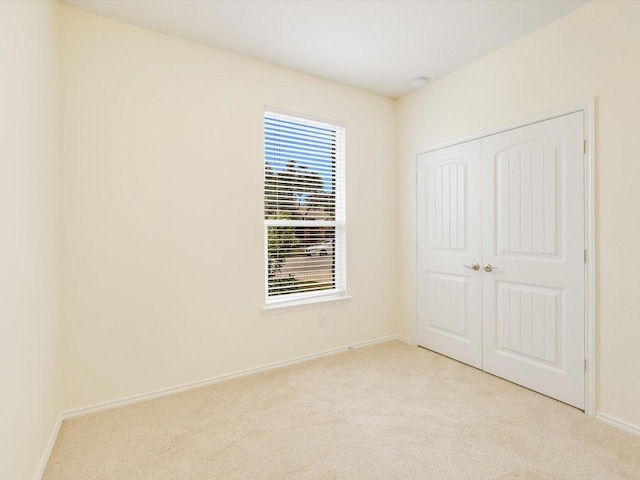 1501 Uhland Dr, Leander, TX 78641 - unfurnished bedroom with light carpet and a closet