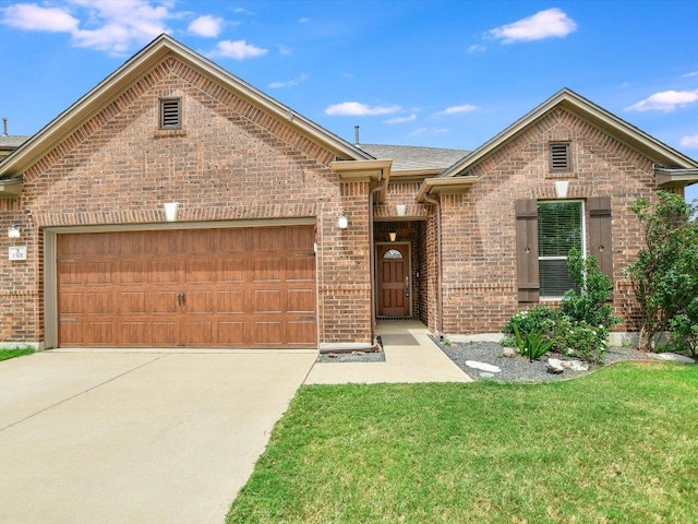 1501 Uhland Dr, Leander, TX 78641 - view of front of property with a garage, brick siding, concrete driveway, and a front yard