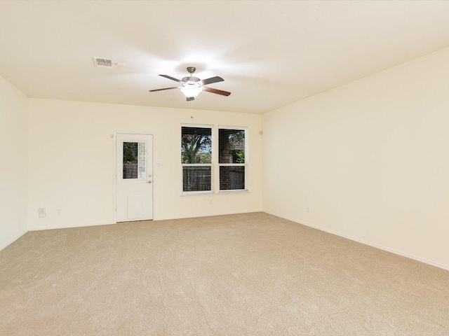 1501 Uhland Dr, Leander, TX 78641 - spare room featuring light colored carpet and a ceiling fan
