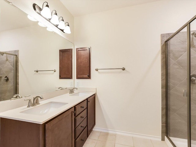 1501 Uhland Dr, Leander, TX 78641 - bathroom featuring double vanity, a shower stall, and tile patterned floors