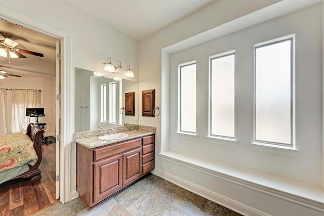 13229 Country Trails Ln, Austin, TX 78732 - full bathroom featuring vanity, a ceiling fan, and ensuite bathroom