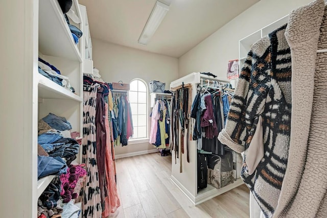 13229 Country Trails Ln, Austin, TX 78732 - walk in closet with light wood-style flooring