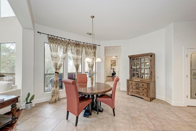 13229 Country Trails Ln, Austin, TX 78732 - dining space featuring light tile patterned flooring and baseboards