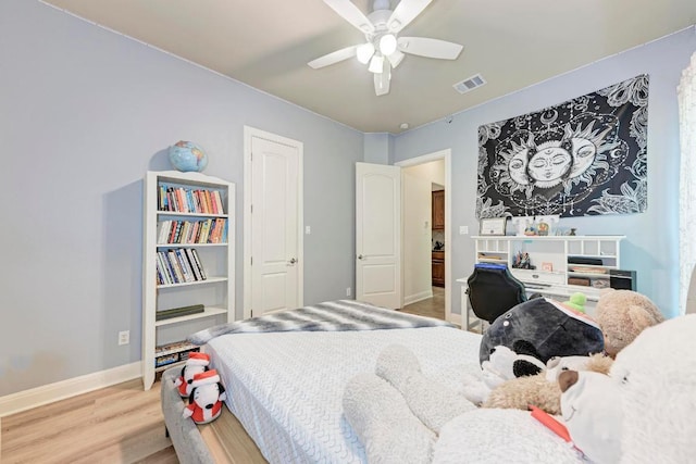 13229 Country Trails Ln, Austin, TX 78732 - bedroom with light wood finished floors and a ceiling fan
