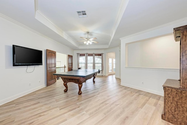 13229 Country Trails Ln, Austin, TX 78732 - recreation room featuring a raised ceiling, ornamental molding, a ceiling fan, light wood-style floors, and french doors