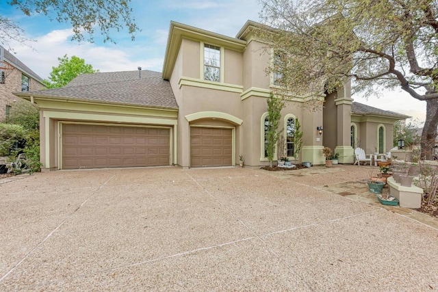 13229 Country Trails Ln, Austin, TX 78732 - view of front of home with concrete driveway, stucco siding, and an attached garage