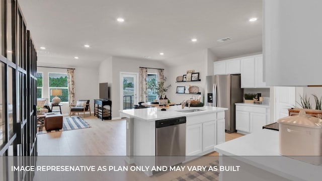 321 Heatherwood Ter, Marble Falls, TX 78654 - kitchen with visible vents, light countertops, white cabinetry, a sink, and appliances with stainless steel finishes