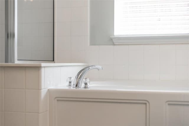 2974 Overland St, Round Rock, TX 78681 - bathroom view of a bath and backsplash