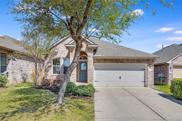 2974 Overland St, Round Rock, TX 78681 - french country inspired facade featuring concrete driveway, an attached garage, a front yard, brick siding, and a shingled roof