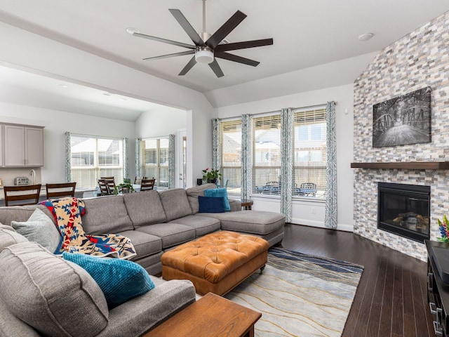 19232 Burrowbridge Rd, Pflugerville, TX 78660 - living area with ceiling fan, vaulted ceiling, dark wood finished floors, and a fireplace