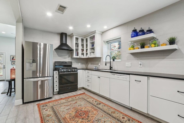 6608 Breezy Pass, Austin, TX 78749 - kitchen with stainless steel fridge with ice dispenser, wall chimney range hood, black range with gas stovetop, white dishwasher, and dark countertops