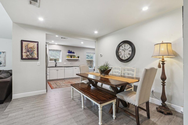 6608 Breezy Pass, Austin, TX 78749 - dining room with light wood finished floors and recessed lighting