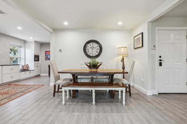 6608 Breezy Pass, Austin, TX 78749 - dining room with light wood finished floors and recessed lighting