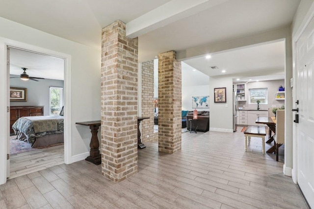 6608 Breezy Pass, Austin, TX 78749 - hall featuring healthy amount of natural light, wood finished floors, beam ceiling, decorative columns, and recessed lighting