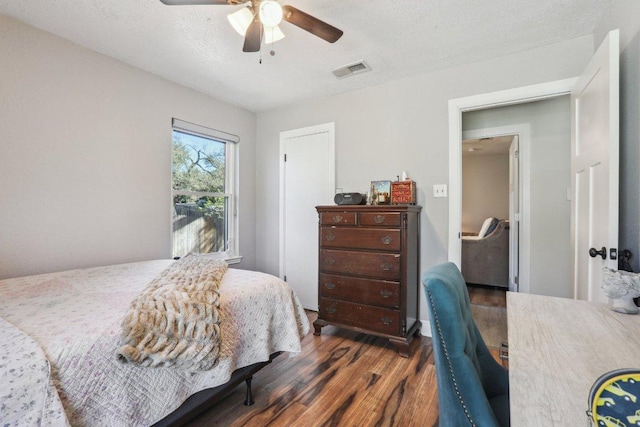 6608 Breezy Pass, Austin, TX 78749 - bedroom with wood finished floors, a ceiling fan, and an office area