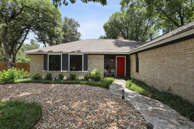 6608 Breezy Pass, Austin, TX 78749 - view of front facade featuring brick siding and roof with shingles